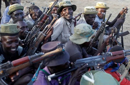 The Wider Image: When raiders menace in northern Kenya, grab your guns