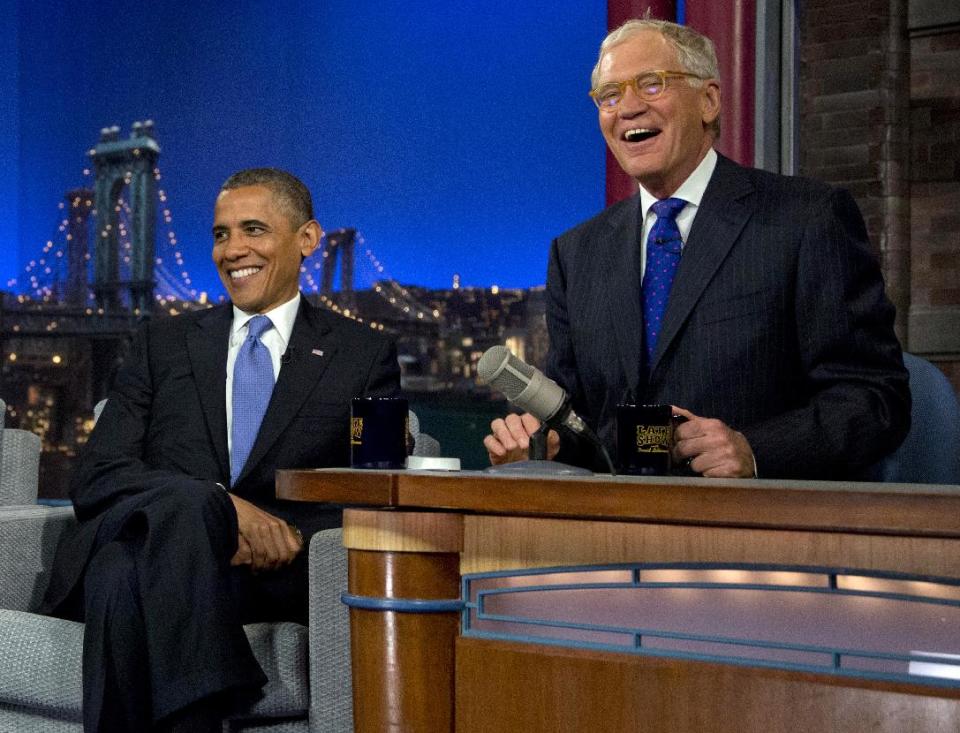 President Barack Obama sits with David Letterman on the set of the "Late Show With David Letterman" at the Ed Sullivan Theater, Tuesday, Sept. 18, 2012, in New York. (AP Photo/Carolyn Kaster)