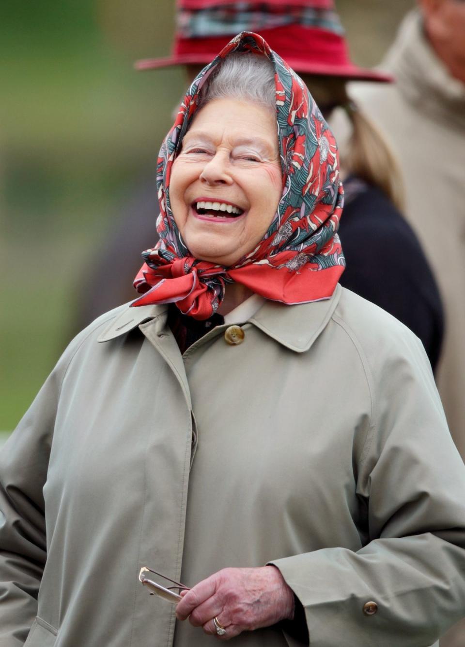 The late Queen showcasing her royal smile
