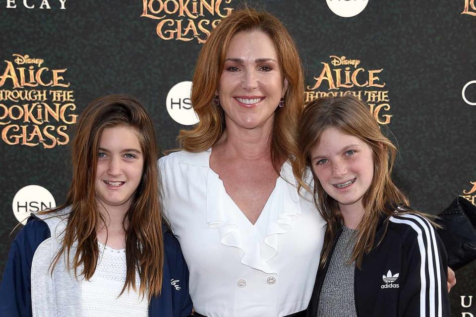 <p>Axelle/Bauer-Griffin/FilmMagic</p> Peri Gilpin (center) with her twin daughters Stella and Ava in Hollywood on May 23, 2016