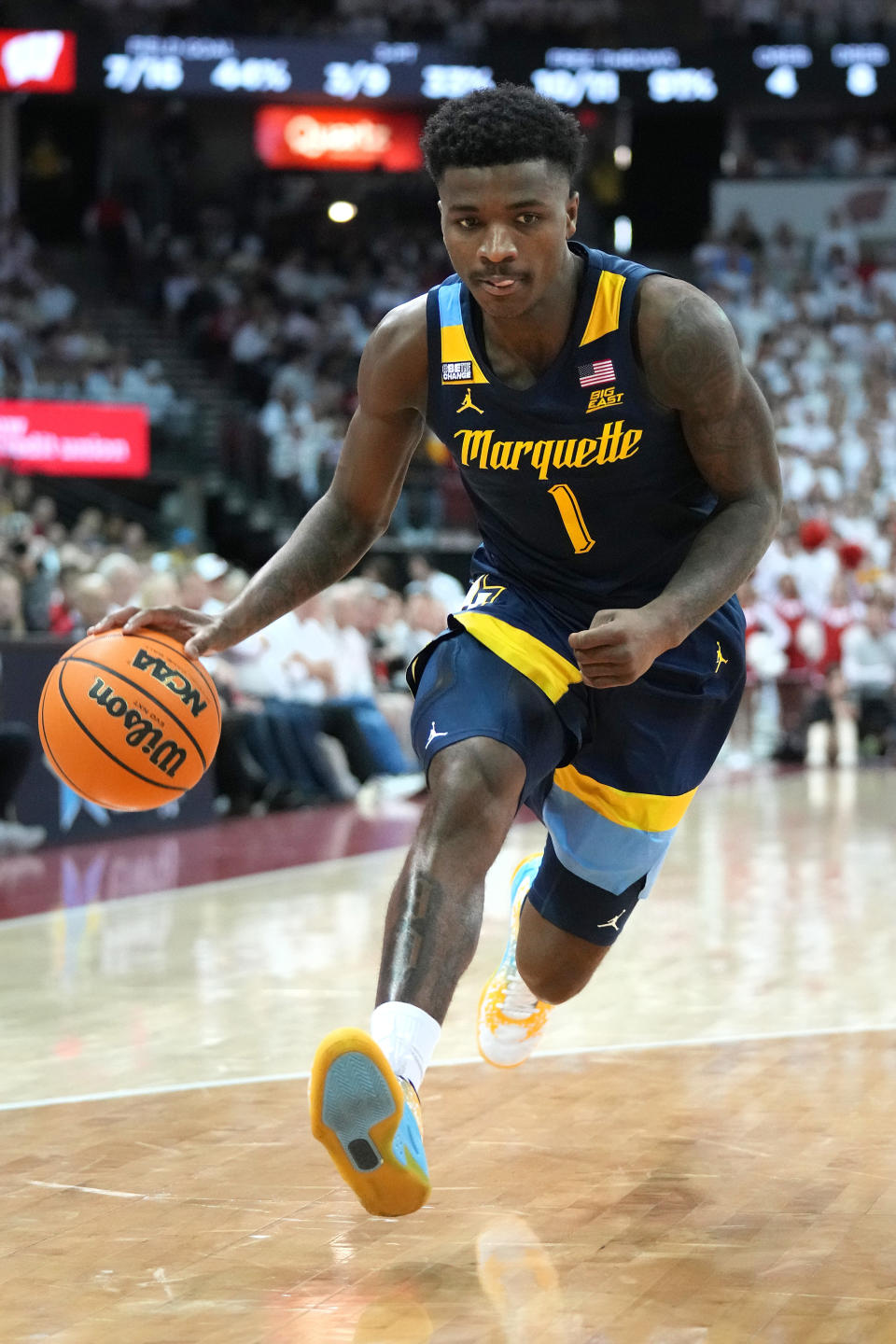 Dec 2, 2023; Madison, Wisconsin, USA; Marquette Golden Eagles guard Kam Jones (1) dribbles the ball against the Wisconsin Badgers during the first half at the Kohl Center. Mandatory Credit: Kayla Wolf-USA TODAY Sports