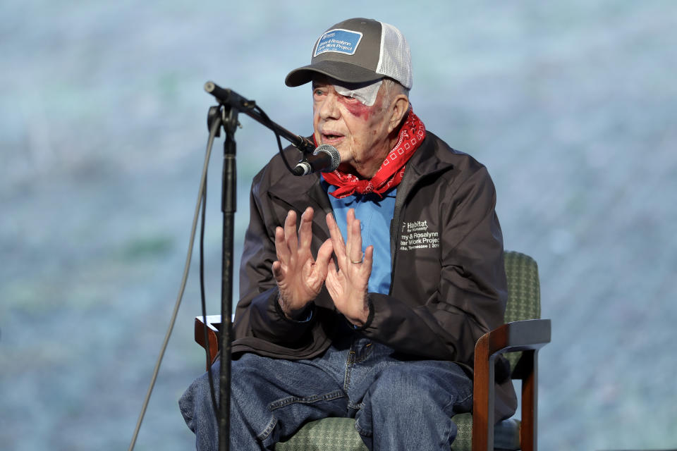 Former President Jimmy Carter leads a morning devotion for volunteers at a Habitat for Humanity building project Monday, Oct. 7, 2019, in Nashville, Tenn. Carter fell at his home on Sunday, requiring over a dozen stitches, but he did not let his injuries keep him from participating in his 36th building project with the nonprofit Christian housing organization. He turned 95 last Tuesday, becoming the first U.S. president to reach that milestone. (AP Photo/Mark Humphrey)