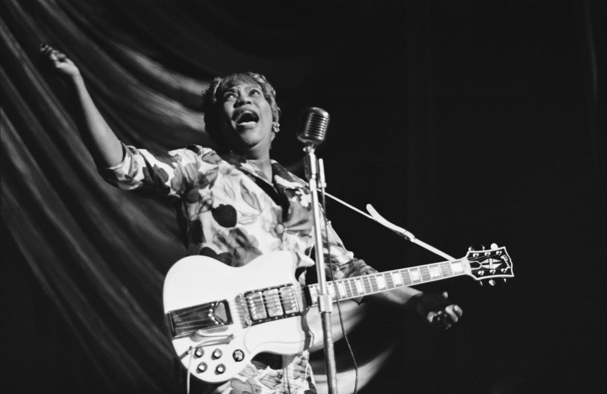 American gospel singer Sister Rosetta Tharpe (1915 - 1973) performs at a Blues and Gospel Caravan tour in the UK, 1964. (Photo: Tony Evans/Getty Images)