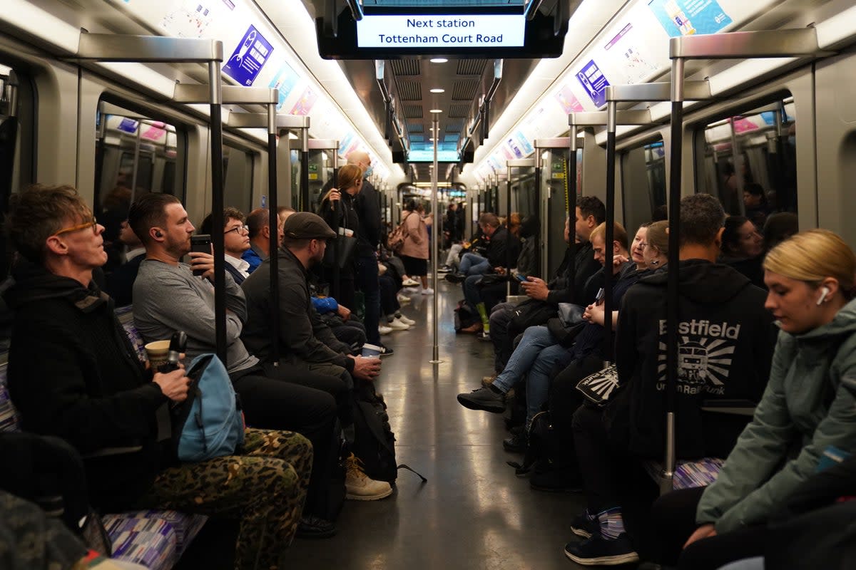 Passengers on an Elizabeth line train  (PA Archive)