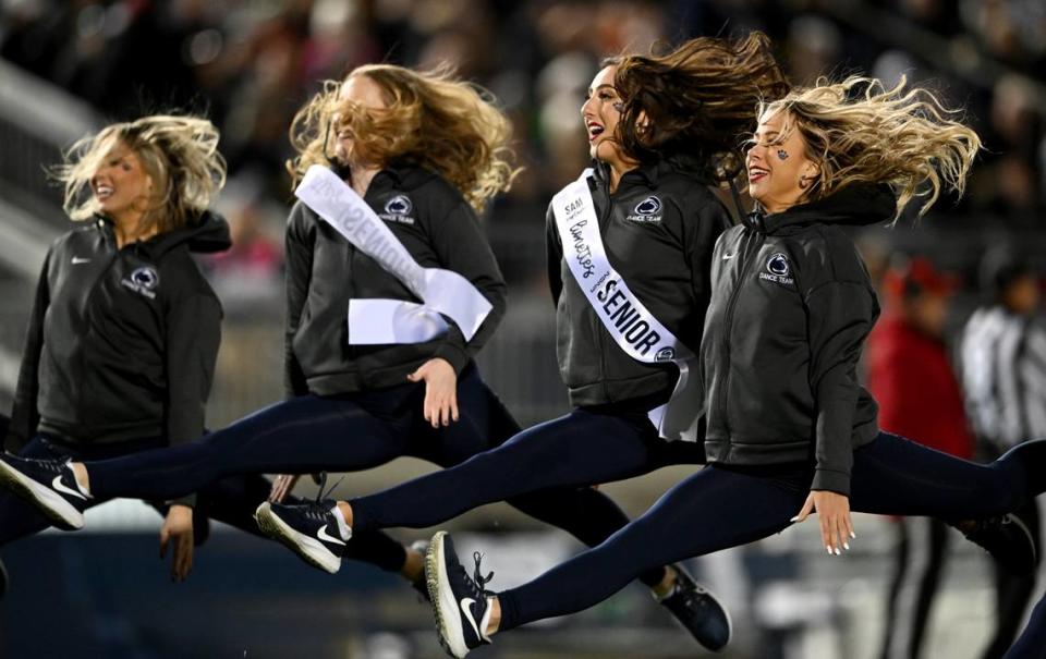 The Penn State Lionettes jump into splits to finish their performance during the football game on Saturday, Nov. 26, 2022.