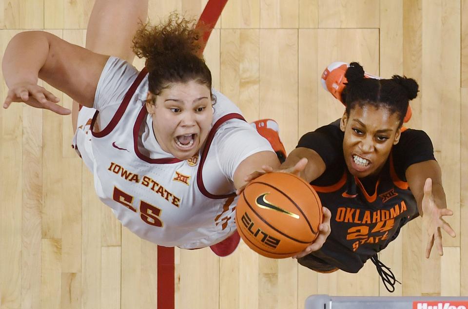 Iowa State Cyclones center Audi Crooks (55) takes a shot around Oklahoma State Cowgirls forward Praise Egharevba (24) during the second quarter in the Big-12 conference matchup at Hilton Coliseum on Wednesday, Jan. 31, 2024, in Ames, Iowa.