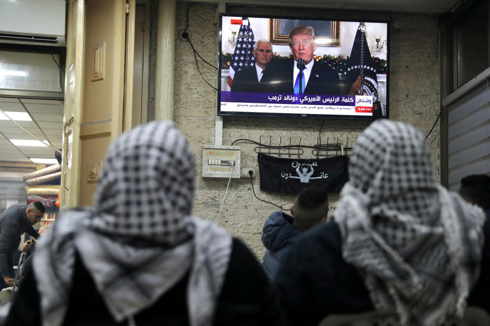 <p>Palestinians watch a televised broadcast of President Donald Trump delivering an address where he is expected to announce that the United States recognises Jerusalem as the capital of Israel, in Jerusalem’s Old City, Dec. 6, 2017. (Photo: Ammar Awad/Reuters) </p>