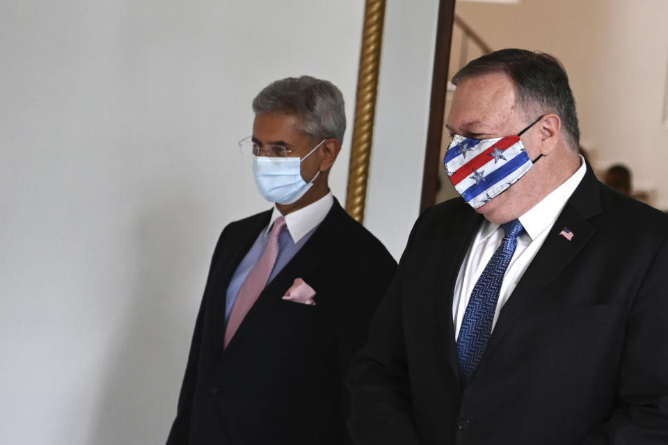 U.S. Secretary of State Mike Pompeo, right, and Indian Foreign Minister Subrahmanyam Jaishankar arrive to attend their meeting in Tokyo, Tuesday, Oct. 6, 2020, ahead of the four Indo-Pacific nations' foreign ministers meeting. (Charly Triballeau/Pool Photo via AP)