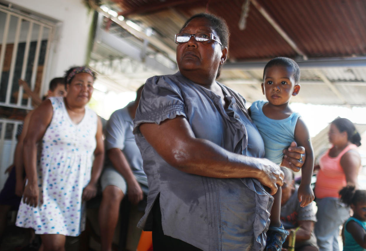 Americans in San Isidro, Puerto Rico, wait for&nbsp;FEMA to arrive with water. Their neighborhood&nbsp;has&nbsp;been without&nbsp;power or&nbsp;clean water for more than a month. (Photo: Mario Tama via Getty Images)