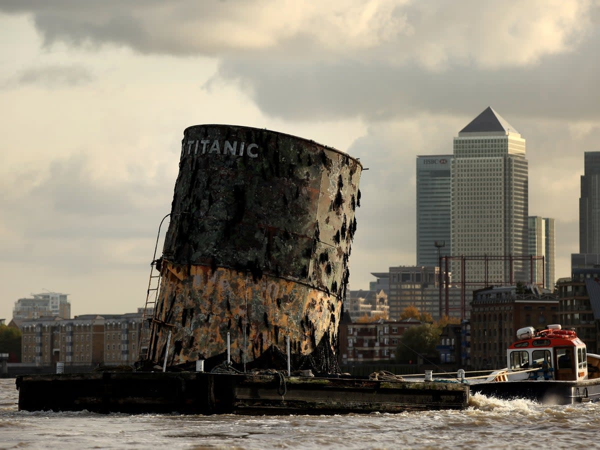 A replica of the Titanic’s fourth funnel is towed along the River Thames in 2010, to launch an exhibition of artefacts at the O2 Bubble (Getty)