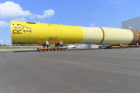 Part of a foundation for an offshore wind turbine rests on rollers outside a manufacturing facility in Paulsboro, N.J. on July 6, 2023. New Jersey's Cape May County and environmental and fishing industry groups are suing the federal government to try to overturn its approval New Jersey's first offshore wind farm, which would be built by Danish company Orsted. (AP Photo/Wayne Parry)