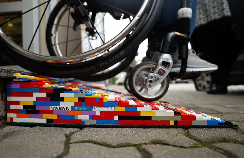 Rita Ebel, nicknamed "Lego grandma", tests one of her wheelchair ramps built from donated Lego bricks in Hanau