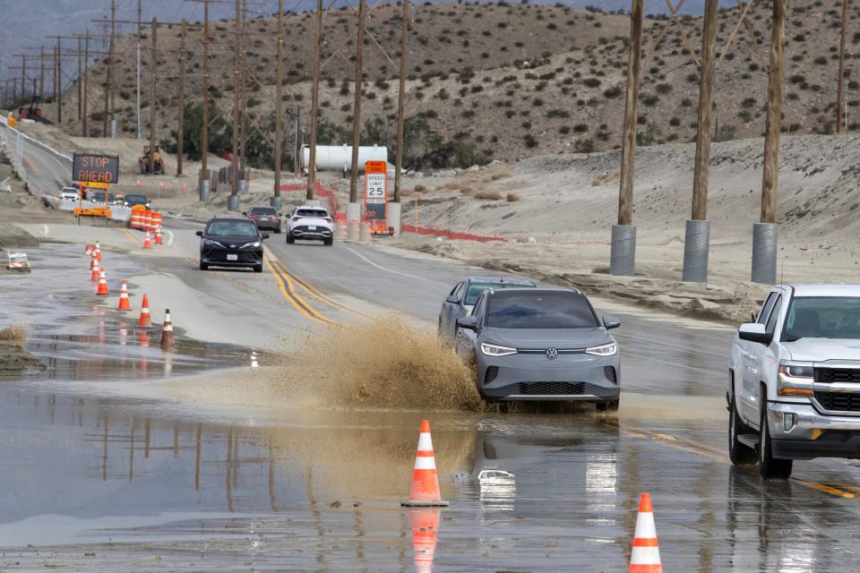 Motorist navigate the flooded southbound lane on Indian Canyon Drive in Palm Springs, Calif., on Sunday morning, February 4, 2024. Forecast predict rainfall for the coming days.
