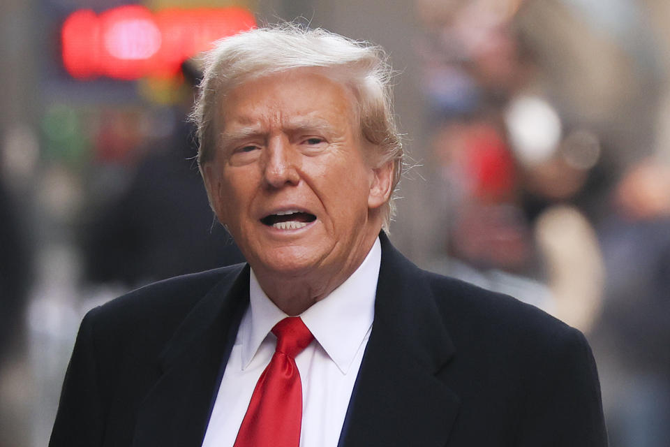 Former President Donald Trump comments as he arrives for a press conference at 40 Wall Street after a pre-trial hearing at Manhattan criminal court, Monday, March 25, 2024, in New York. A New York judge has scheduled an April 15 trial date in former President Donald Trump's hush money case. Judge Juan M. Merchan made the ruling Monday. (AP Photo/Yuki Iwamura)