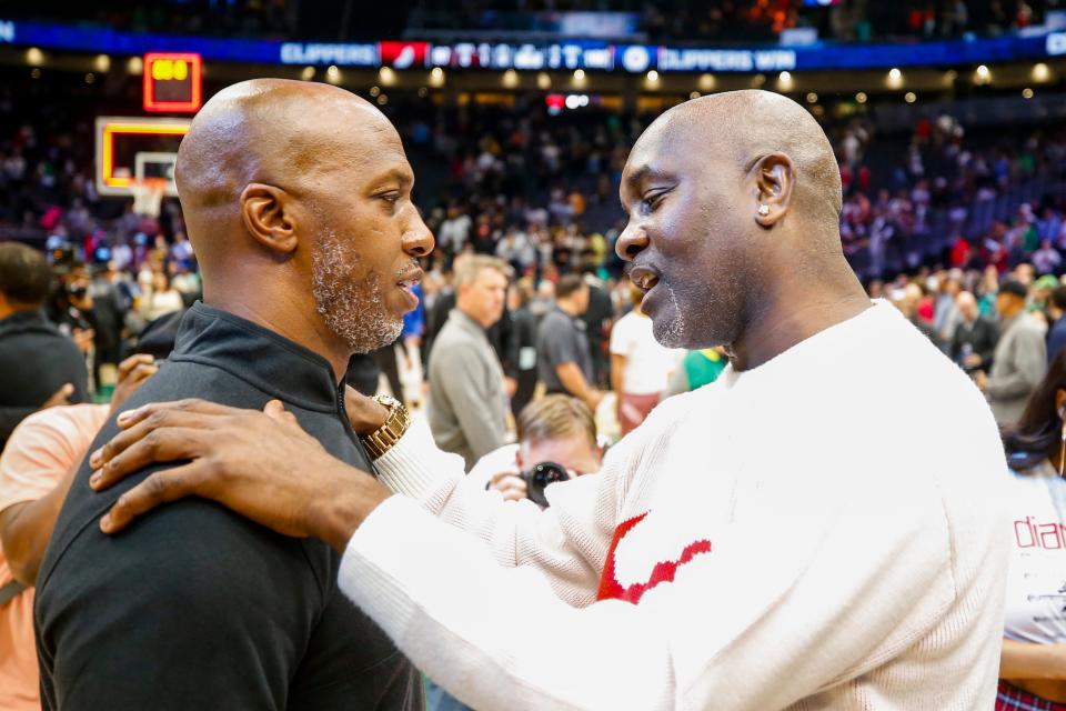 Portland Trail Blazers head coach Chauncey Billups, left, talks with former Seattle Supersonics point guard Gary Payton at Climate Pledge Arena. Mandatory Credit: Joe Nicholson-USA TODAY Sports