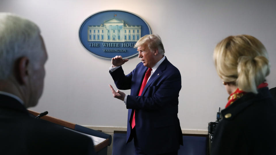 FILE - In this March 31, 2020, file photo President Donald Trump speaks about the coronavirus in the James Brady Press Briefing Room of the White House in Washington, as Vice President Mike Pence and Dr. Deborah Birx, White House coronavirus response coordinator, listen. Trump in recent days has grumbled that American companies such as 3M and GM are not doing enough to provide American medical workers and first responders with vital equipment they need. (AP Photo/Alex Brandon, File)