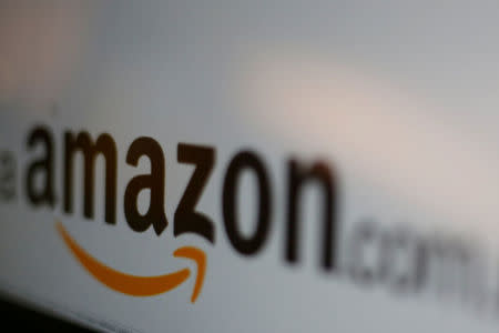 FILE PICTURE - The logo of the web service Amazon is pictured in this June 8, 2017 illustration photo. REUTERS/Carlos Jasso/Illustration/File Photo