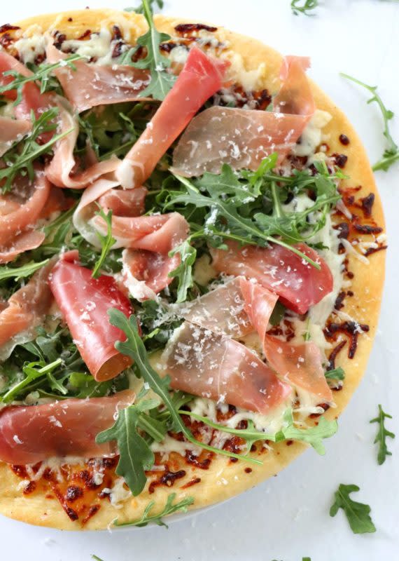 <p>Prosciutto and arugula pizza is the perfect combination of salty from the prosciutto and peppery from the arugula.</p><p><strong>Get the recipe: <a href="https://dashofsavory.com/prosciutto-arugula-pizza/" rel="nofollow noopener" target="_blank" data-ylk="slk:Prosciutto Arugula Pizza;elm:context_link;itc:0;sec:content-canvas" class="link rapid-noclick-resp">Prosciutto Arugula Pizza</a></strong></p><p><strong>Related: <a href="https://parade.com/846554/carolborchardt/15-fantastic-flatbread-pizza-ideas/" rel="nofollow noopener" target="_blank" data-ylk="slk:15 Easy Flatbread Pizza Recipes;elm:context_link;itc:0;sec:content-canvas" class="link rapid-noclick-resp">15 Easy Flatbread Pizza Recipes</a></strong></p>