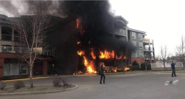 Residents evacuated the Citadel Mews residence Thursday night after a fire broke out that engulfed much of the building.  (Submitted by Jackson Brown - image credit)