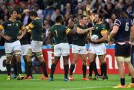 Rugby Union - South Africa v United States of America - IRB Rugby World Cup 2015 Pool B - Olympic Stadium, London, England - 7/10/15 Bismarck du Plessis celebrates with team mates after scoring a try for South Africa Reuters / Toby Melville Livepic