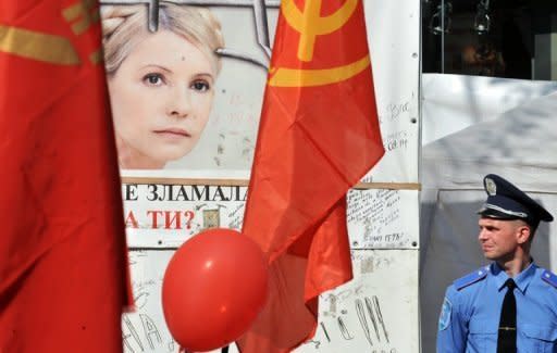 A policeman guards a camp of jailed Ukrainian opposition leader Yulia Tymoshenko supporters in Kiev May 1, 2012. Tymoshenko was on Wednesday moved from her prison to a hospital for treatment by a team including a German doctor, the prisons service said