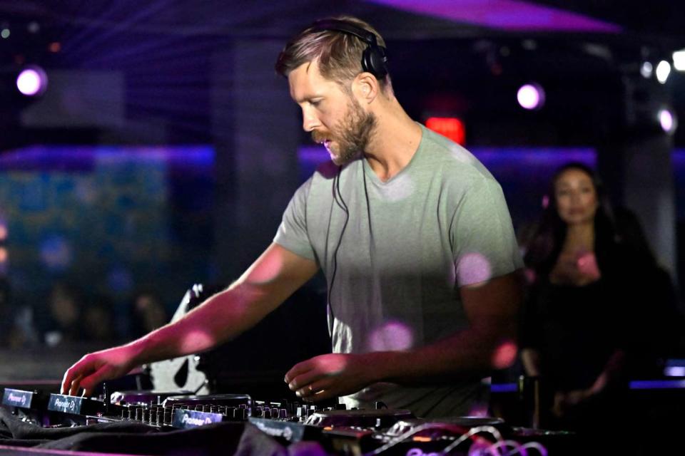 <p>David Becker/Getty</p> Calvin Harris performing during the FanDuel Super Bowl party in Las Vegas in February 2024