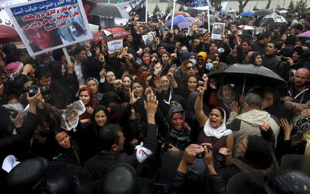 Members of civil society organisations chant slogans during a protest to condemn the killing of 27-year-old woman, Farkhunda, who was beaten with sticks and set on fire by a crowd of men in central Kabul in broad daylight on Thursday, in Kabul, in this file picture taken March 24, 2015. REUTERS/Omar Sobhani/Files