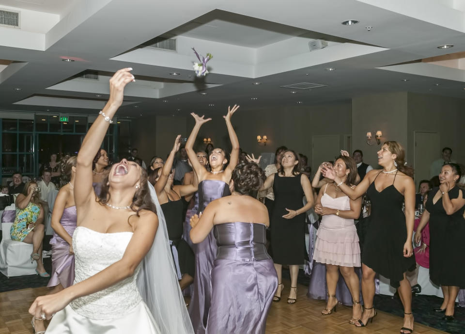 bride throwing the bouquet