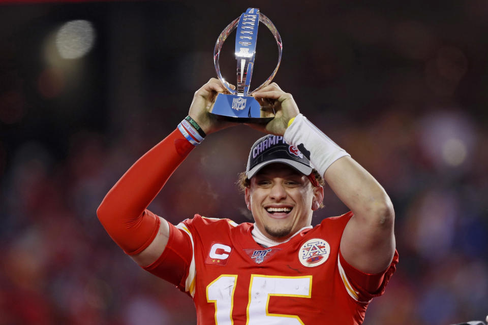 Kansas City Chiefs' Patrick Mahomes celebrates with the Lamar Hunt Trophy after the NFL AFC Championship football game against the Tennessee Titans Sunday, Jan. 19, 2020, in Kansas City, MO. The Chiefs won 35-24 to advance to Super Bowl 54. (AP Photo/Charlie Neibergall)