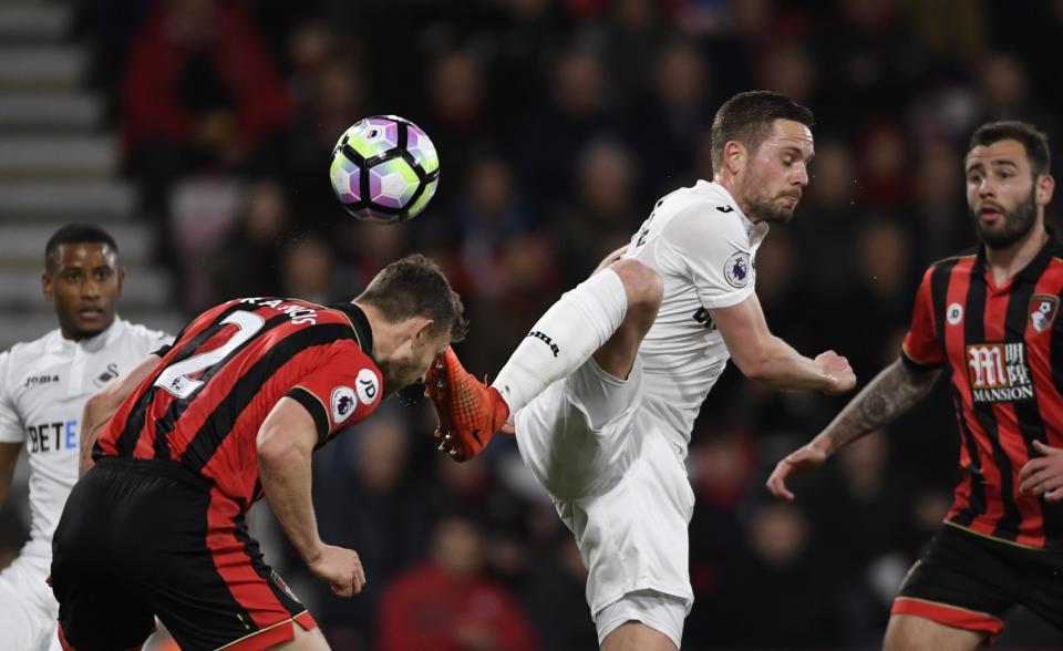 <p>Swansea City’s Gylfi Sigurdsson in action with Bournemouth’s Simon Francis </p>