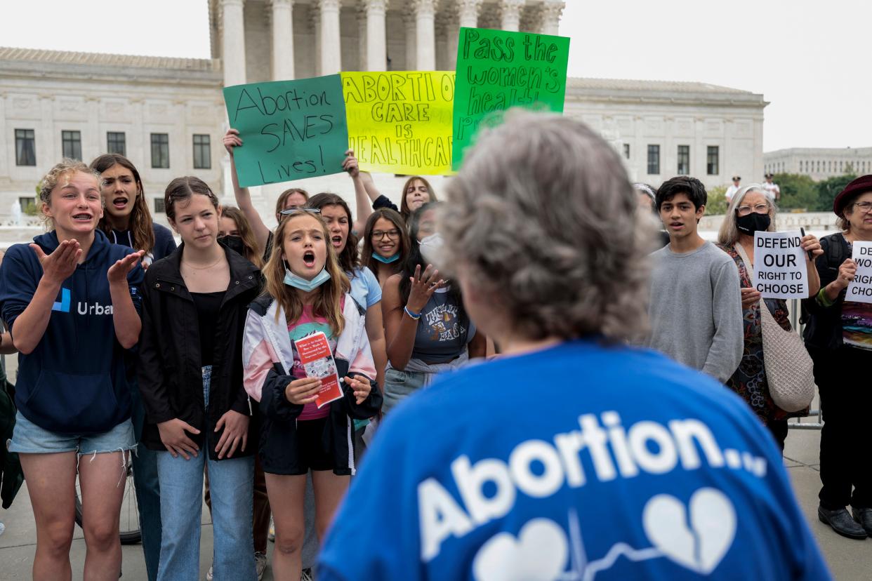 Abortion-rights advocates confront anti-abortion advocates in front of the U.S. Supreme Court Building on May 4, 2022.