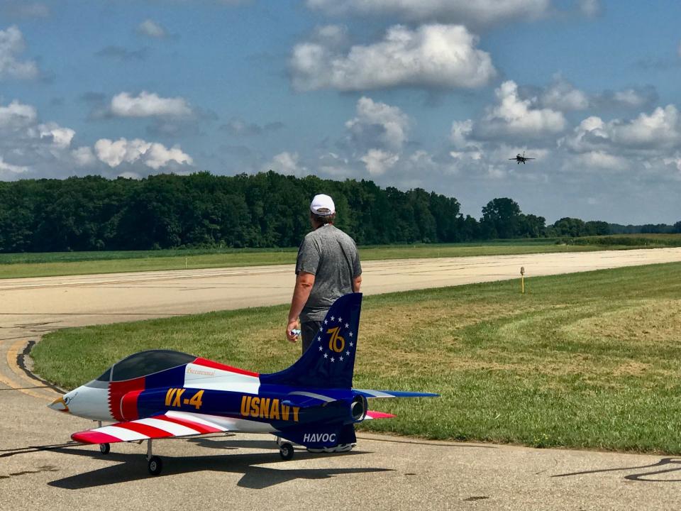 Rob Vargo watches as a model jet comes in for a landing at Custer Airport.