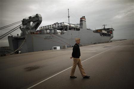 A U.S army personnel walks past U.S. MV Cape Ray docked at the naval airbase in Rota, near Cadiz, southern Spain, in this February 13, 2014 file photo. REUTERS/Jon Nazca/Files