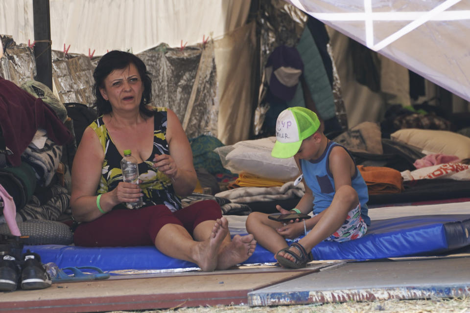 Ukrainian refugees rest at a camp in Utopia Park, Iztapalapa, Mexico City, Monday, May 2, 2022. (AP Photo/Marco Ugarte)