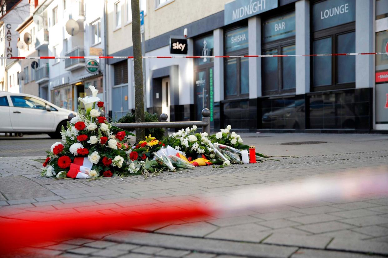 Flowers are placed at a makeshift memorial for the victims of the Hanau shooting: AFP via Getty Images