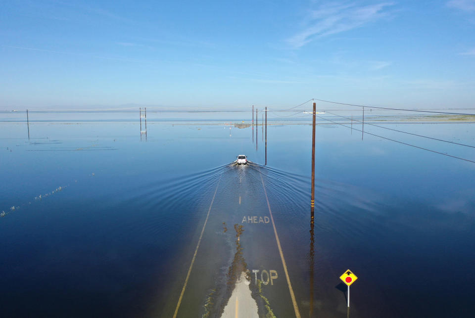 A vehicle drives through floodwaters near Corcoran, Calif (Mario Tama / Getty Images file )