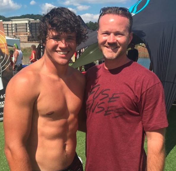 Shirtless Chandler Powell with dad Chris Powell at a wakeboarding competition