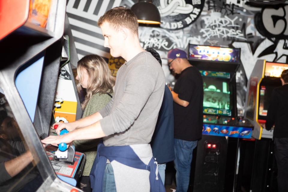 Party-goers celebrated Cobra Arcade's three-year anniversary party by playing vintage games, eating tacos and drinking adult beverages on Tuesday, Jan. 8, 2019 in Phoenix.