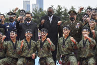 U.S. Secretary of Defense Lloyd J. Austin III, center, and South Korean Defense Minister Suh Wook, second left, pose with South Korean 2nd army command soldiers during a ceremony of the SCM (Security Consultative Meeting) at the great parade ground in the Ministry of National Defense in Seoul, South Korea, Thursday, Dec. 2, 2021. U.S. Defense Secretary Lloyd Austin said Thursday that China’s pursuit of hypersonic weapons “increases tensions in the region” and vowed the U.S. would maintain its capability to deter potential threats posed by China. (Jeon Heon-ky/Pool Photo via AP)