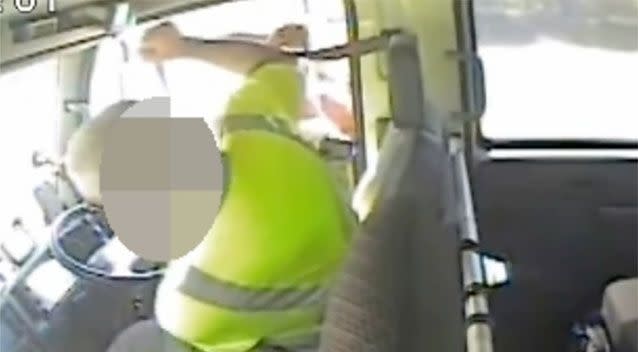 The truck driver folding back after being hit in the footage. Source: QPS media.