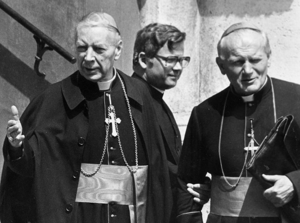 FILE - In this Oct. 16, 1978 file photo, Karol Cardinal Wojtyla, right, is pictured together with Stefan Cardinal Wyszynski, left, when both head for the cardinals congregation meeting in Vatican City. Cardinal Wojtyla has been elected as successor for late Pope John Paul I by the conclavists and will head the catholic church by the name of Pope John Paul II as the first non-Italian Pope in 450 years. Poland's top political leaders gathered in a Warsaw church Sunday, Sept. 12, 2021 for the beatification of two revered figures of the Catholic church — a cardinal who led the Polish church's resistance to communism and a blind nun who devoted her life to helping others who couldn't see. (AP Photo, File)