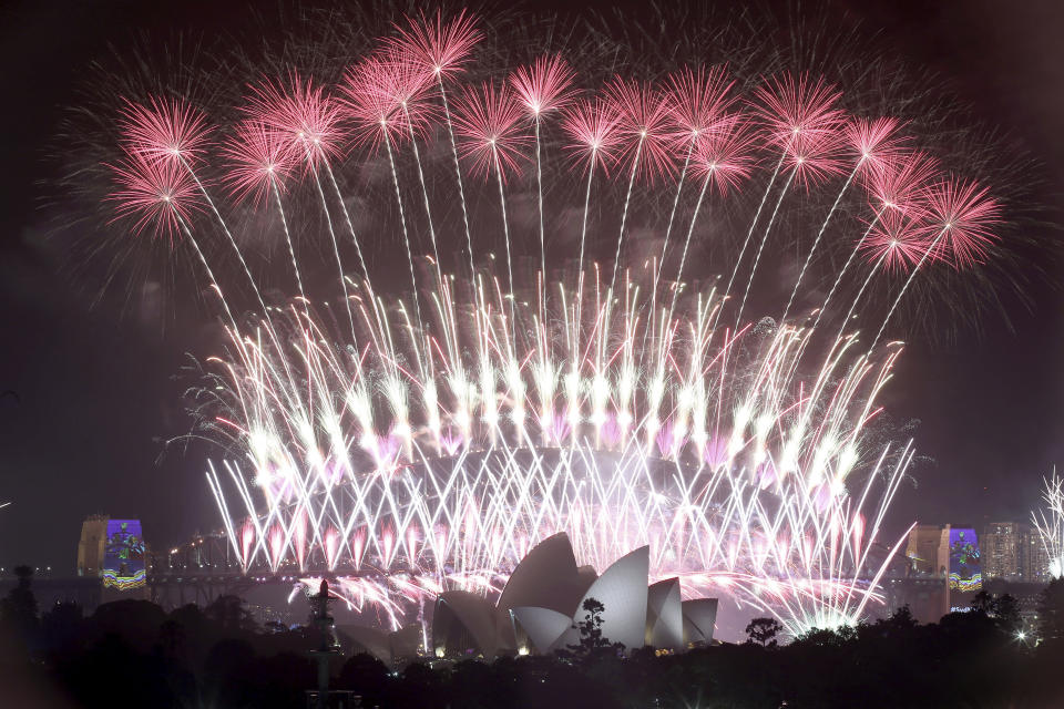 FILE - In this Jan. 1, 2017, file photo, fireworks explode over the Sydney Opera House and Harbour Bridge as New Year's celebrations are underway in Sydney. Australia's Prime Minister Scott Morrison says Sunday, Dec. 29, 2019, Sydney's iconic New Year's Eve fireworks will go ahead despite the wildfire crisis to show the world "Australia’s resiliency.“ Authorities meanwhile braced for conditions to deteriorate with high temperatures. (AP Photo/Rick Rycroft, File)