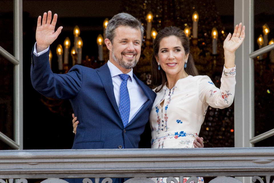  Crown Prince Frederik of Denmark and Crown Princess Mary of Denmark appear on the balcony as the Royal Life Guards carry out the changing of the guard on Amalienborg Palace square on the occasion of the 50th birthday of The Crown Prince Frederik of Denmark on May 26, 2018 in Copenhagen, Denmark.