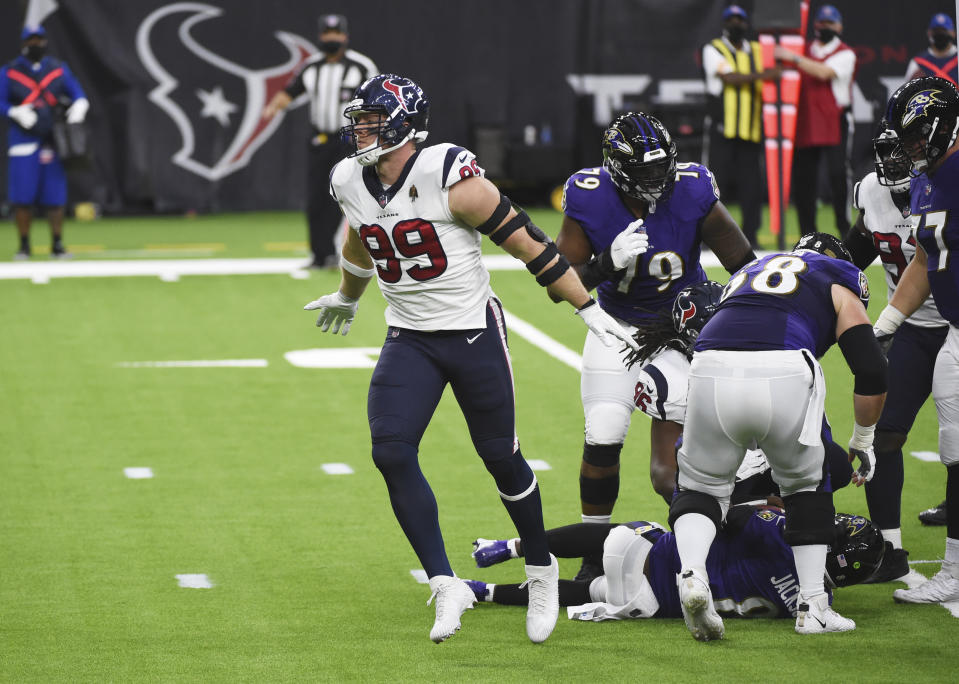 Houston Texans defensive end J.J. Watt (99) celebrates after sacking Baltimore Ravens quarterback Lamar Jackson during the first half of an NFL football game Sunday, Sept. 20, 2020, in Houston. (AP Photo/Eric Christian Smith)