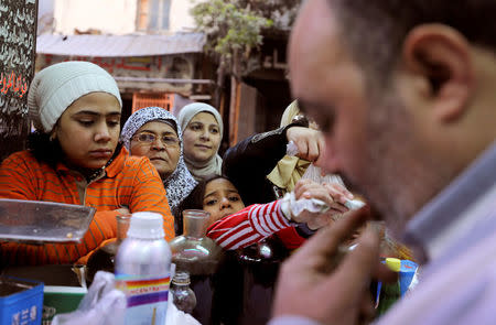 Customers buy natural herbal drugs and consumer goods at herbal store, in Cairo, Egypt January 10, 2017. REUTERS/Mohamed Abd El Ghany