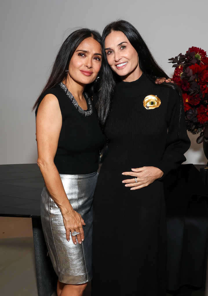 (L-R) Salma Hayek and Demi Moore at the Frequency opening reception on Nov. 2 in Los Angeles.