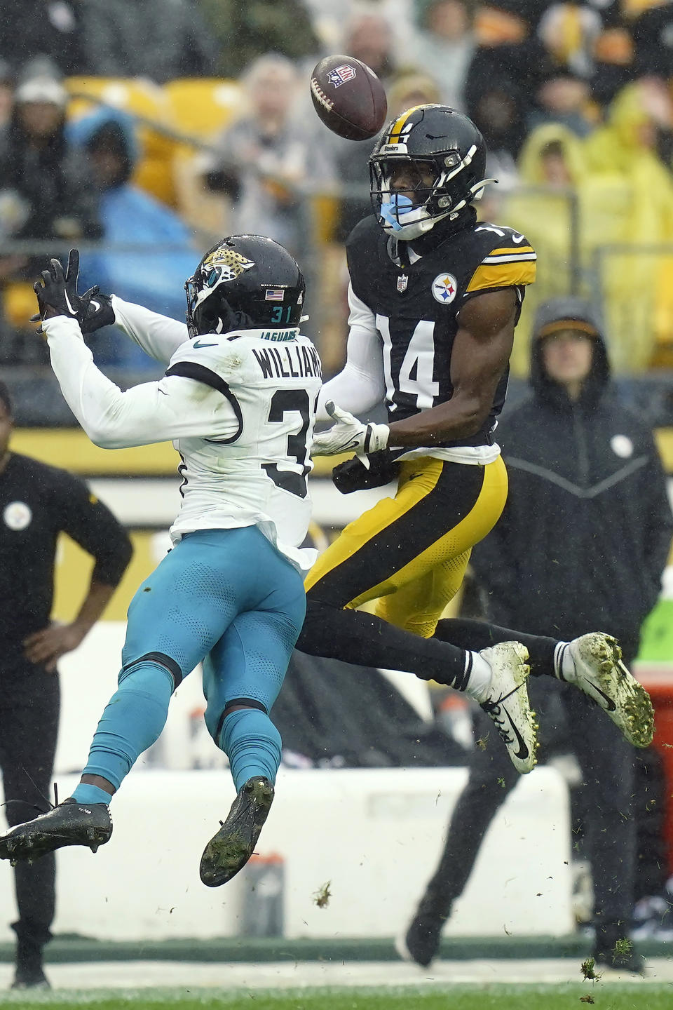 Jacksonville Jaguars cornerback Montaric Brown (30) breaks up a pass intended for Pittsburgh Steelers wide receiver George Pickens (14) during the first half of an NFL football game Sunday, Oct. 29, 2023, in Pittsburgh. (AP Photo/Matt Freed)
