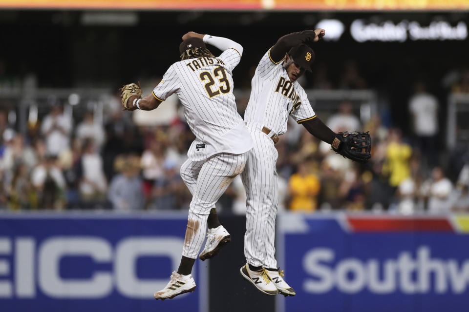 San Diego Padres' Trent Grisham, right, celebrates with Fernando Tatis Jr. after the Padres defeated the Oakland Athletics in a baseball game Tuesday, July 27, 2021, in San Diego. (AP Photo/Derrick Tuskan)