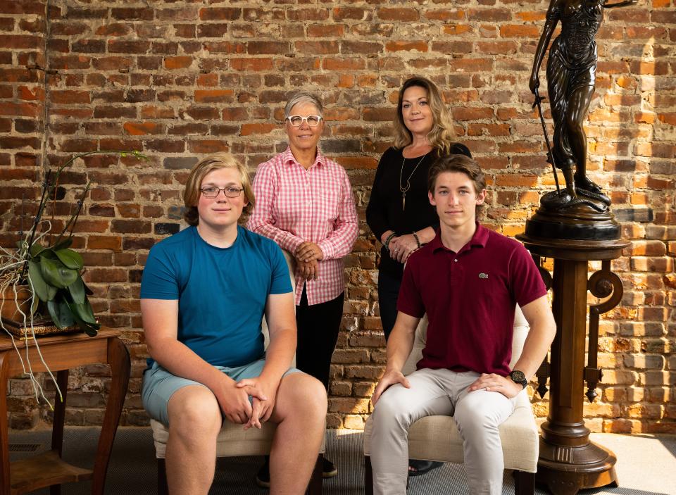 Erin Porterfield, back left, and Kristin Williams, back right, along with their children, Cameron Porter Williams, 16, front left, and Kadin Porter Williams, 18, at Omaha family law firm Koenig | Dunne in Omaha, Nebraska, Wednesday, August 4, 2021. (Photo by Rebecca S. Gratz for ACLU of Nebraska)