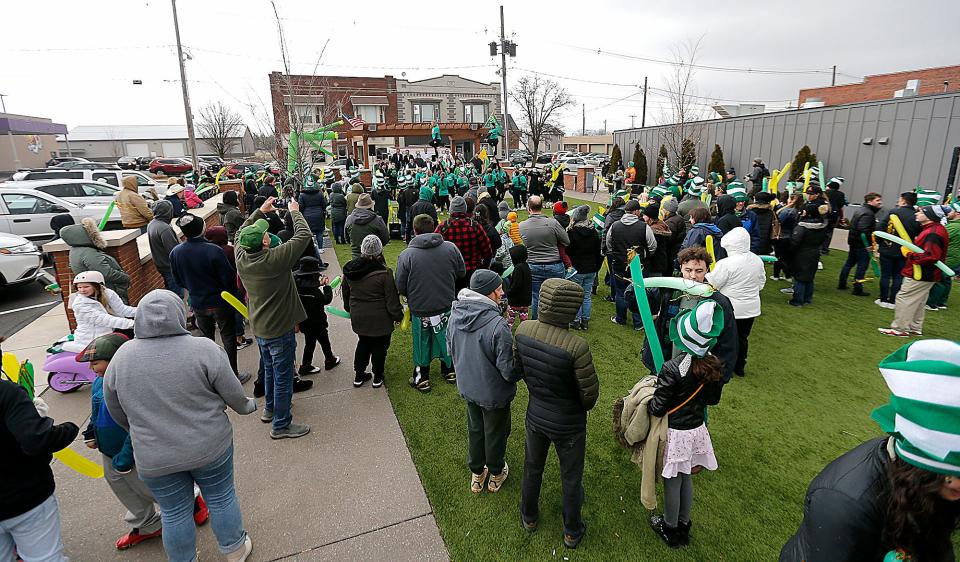 A large crowd gathers in Foundation Plaza for St. Patrick's Day festivities on Friday.